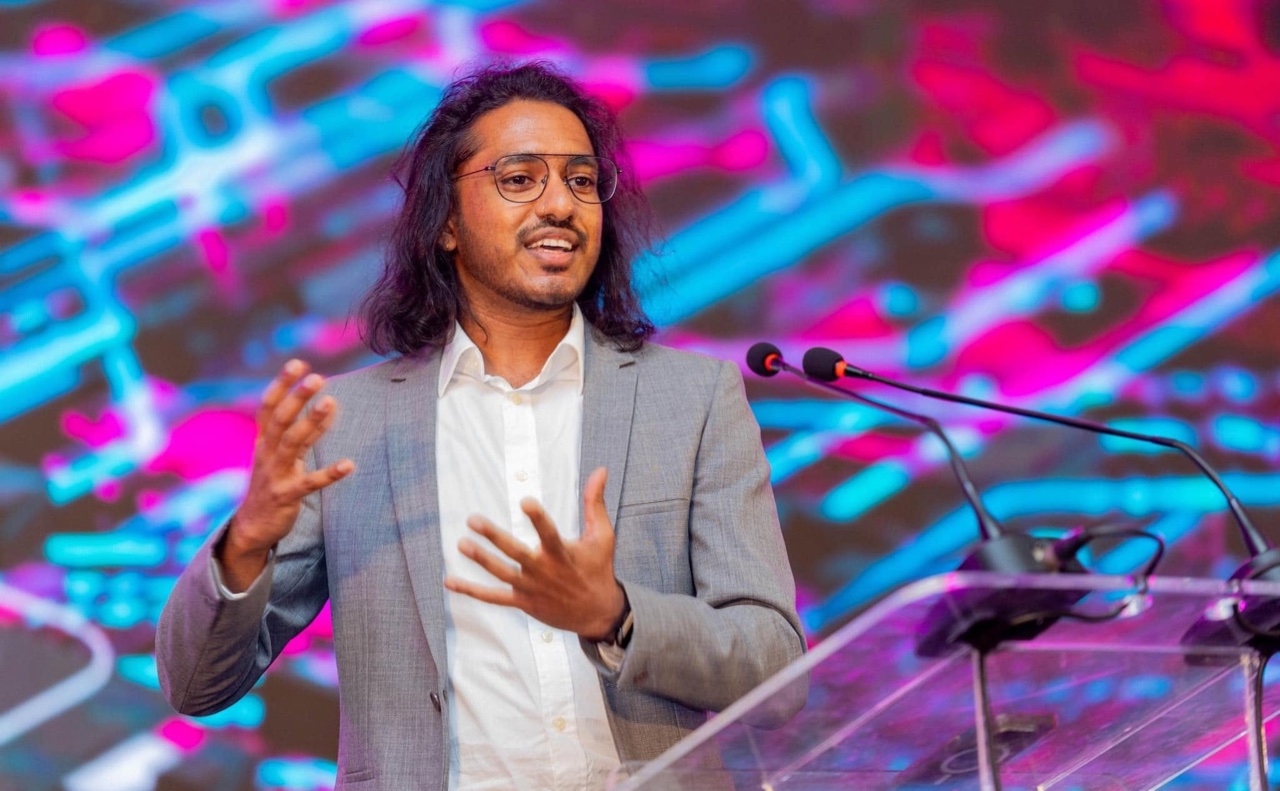 Rajith Vidanaarachchi speaking at a podium at the DoIT Summit